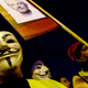 Demonstrators sporting Guy Fawkes masks take part in a protest called by Catalan National Assembly (ANC) under the motto “Journalism is not a crime” to support WikiLeaks founder Julian Assange in Barcelona on February 24, 2020.
